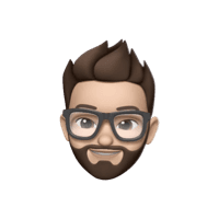 Memoji of a man with glasses and beard