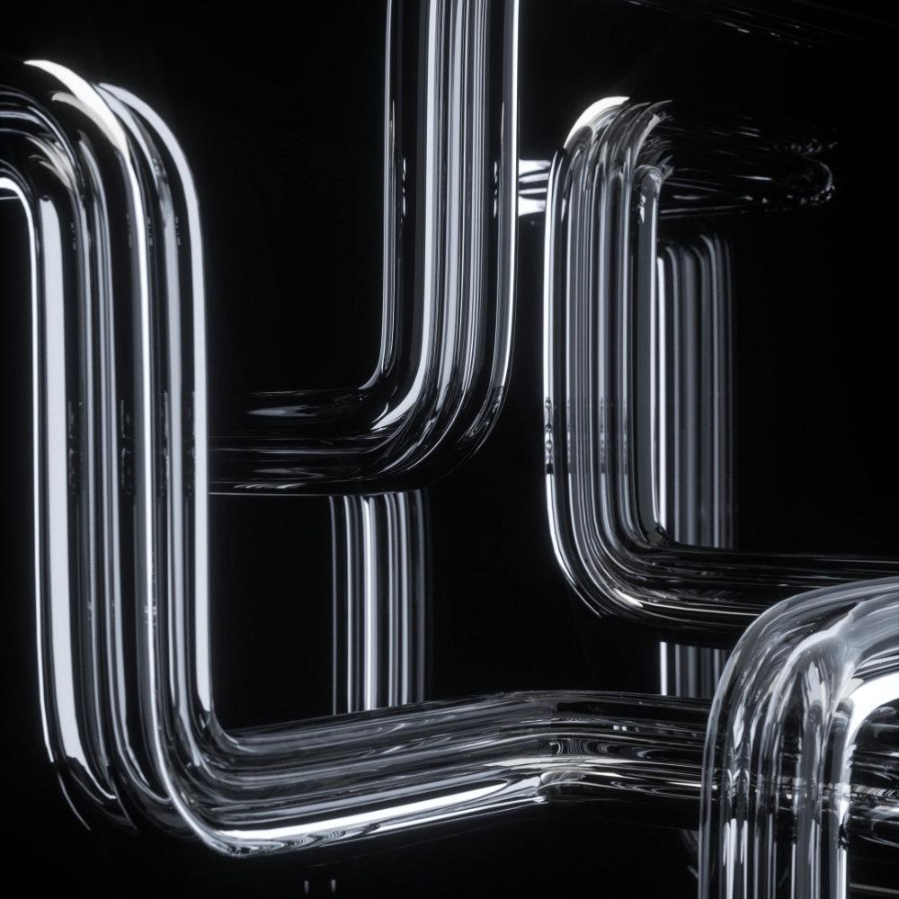 Metallic pipes in front of a dark background